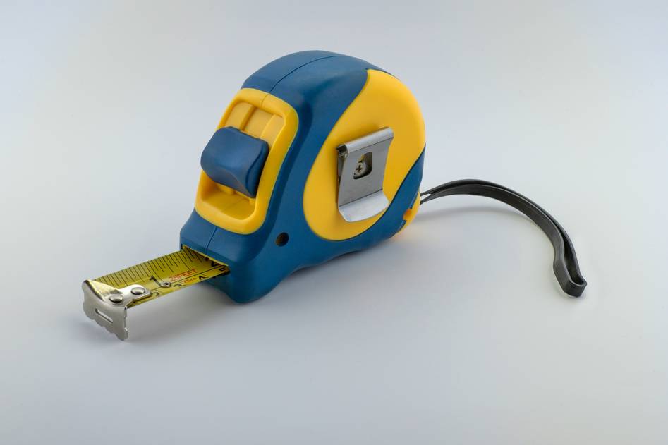 Measuring tape extended across home decor layout